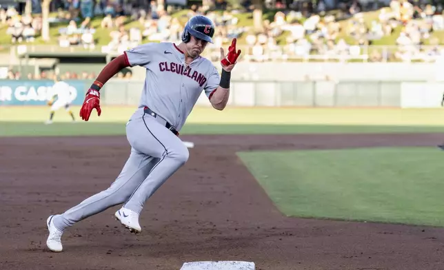 Cleveland Guardians' Nolan Jones rounds third base to score during the second inning of a baseball game against the Athletics Saturday, June 21, 2025, in West Sacramento, Calif. (AP Photo/Sara Nevis)