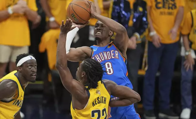 Oklahoma City Thunder forward Jalen Williams (8) shoots over Indiana Pacers forward Aaron Nesmith (23) during the first half of Game 6 of the NBA Finals basketball series, Thursday, June 19, 2025, in Indianapolis. (AP Photo/Michael Conroy)