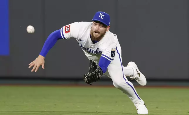 Kansas City Royals center fielder Kyle Isbel makes a diving catch of a fly ball hit by Athletics' Denzel Clarke during the seventh inning of a baseball game in Kansas City, Mo., Friday, June 13, 2025. (AP Photo/Colin E. Braley)
