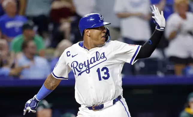 Kansas City Royals' Salvador Perez reacts as he scores off a Nick Loftin triple during the ninth inning of a baseball game against the Athletics in Kansas City, Mo., Friday, June 13, 2025. (AP Photo/Colin E. Braley)