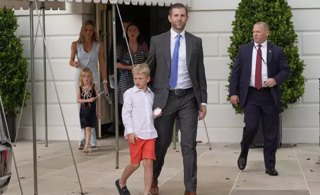Eric Trump and his wife Lara, along with their children, depart the White House with President Donald Trump and first lady Melania Trump ahead of an parade to honor the Army's 250th anniversary, coinciding with Trump's 79th birthday, Saturday, June 14, 2025, in Washington. (AP Photo/Mark Schiefelbein)