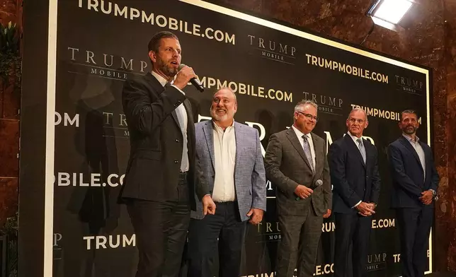 Eric Trump, Don Hendrickson, Eric Thomas, Patrick O'Brien and Donald Trump Jr., left to right, participate in the announcement of Trump Mobile, in New York's Trump Tower, Monday, June 16, 2025. (AP Photo/Richard Drew)