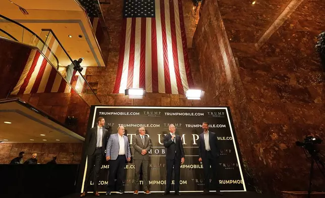 Eric Trump, Don Hendrickson, Eric Thomas, Patrick O'Brien and Donald Trump Jr., left to right, participate in the announcement of Trump Mobile, in New York's Trump Tower, Monday, June 16, 2025. (AP Photo/Richard Drew)