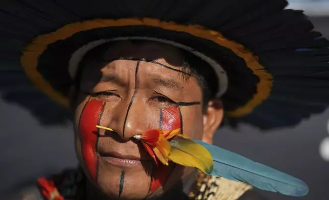 An Indigenous man protests against the auction of dozens of oil blocks, including blocks near the mouth of the Amazon River, in Rio de Janeiro, Tuesday, June 17, 2025. (AP Photo/Silvia Izquierdo)