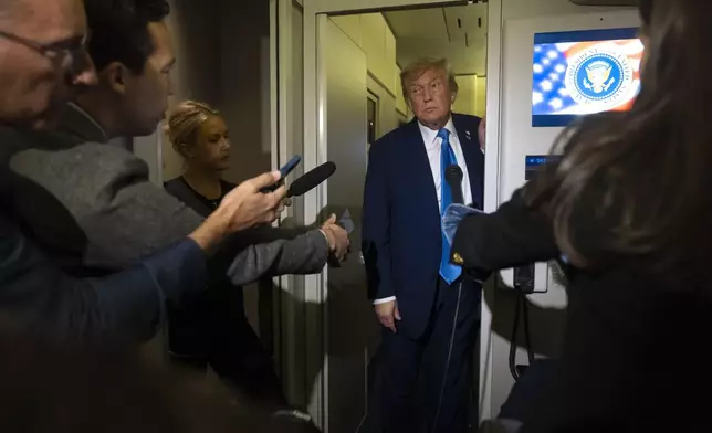 President Donald Trump speaks with reporters while flying aboard Air Force One en route from Calgary, Canada to Joint Base Andrews, Md., late Monday, June 16, 2025. (AP Photo/Mark Schiefelbein)