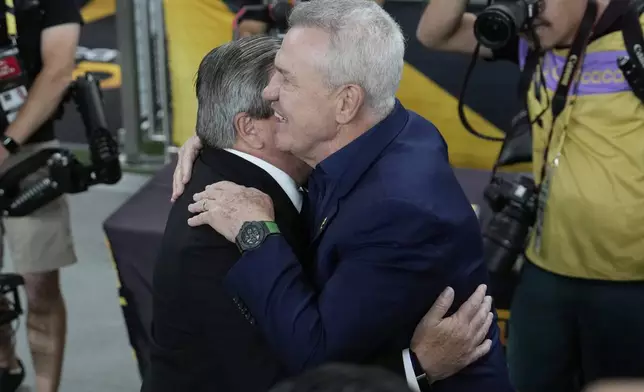 Mexico head coach Javier Aguirre, right, and Costa Rica Miguel Herrera embrace before a CONCACAF Gold Cup soccer match Sunday, June 22, 2025, in Las Vegas. (AP Photo/John Locher)