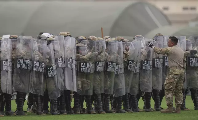 Members of the California National Guard conduct exercises after being deployed to the Los Angeles protests Wednesday, June 11, 2025, in Los Alamitos, Calif. (AP Photo/Jae C. Hong)