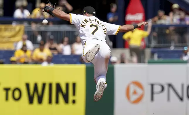 Pittsburgh Pirates shortstop Isiah Kiner-Falefa knocks down a ball hit by Miami Marlins' Eric Wagaman before fielding it to make the out at first during the eighth inning of a baseball game Wednesday, June 11, 2025, in Pittsburgh. (AP Photo/Matt Freed)