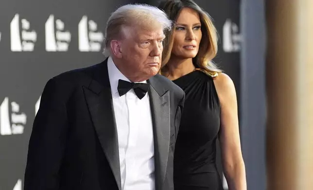 President Donald Trump and first lady Melania Trump arrive to view opening night of "Les Miserables," at the Kennedy Center, Wednesday, June 11, 2025, in Washington. (AP Photo/Alex Brandon)