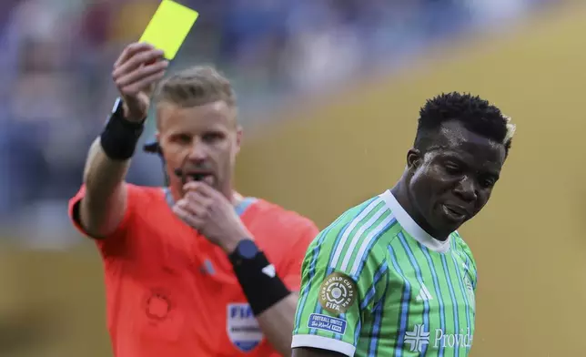 Seattle Sounders' Nouhou Toloreacts after getting a yellow card during the Club World Cup group B soccer match between Botafogo and Seattle Sounders at Seattle Lumen Field, in Seattle, Sunday, June 15, 2025. (AP Photo/Ryan Sun)