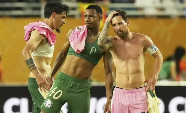 Palmeiras' Allan and Inter Inter Miami's Lionel Messi meet after the Club World Cup Group A soccer match between Inter Miami and Palmeiras in Miami Gardens, Fla., Monday, June 23, 2025. (AP Photo/Marta Lavandier)