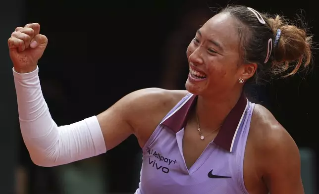 China's Zheng Qinwen celebrates beating Russia's Liudmila Samsonova during their fourth round match of the French Tennis Open, at the Roland-Garros stadium, in Paris, Sunday, June 1 2025. (AP Photo/Lindsey Wasson)