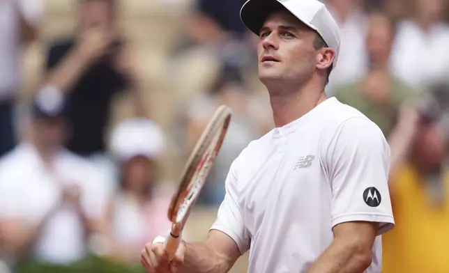 Tommy Paul of the U.S. reacts after beating Australia's Alexei Popyrin during their fourth round match of the French Tennis Open, at the Roland-Garros stadium, in Paris, Sunday, June 1 2025. (AP Photo/Lindsey Wasson)
