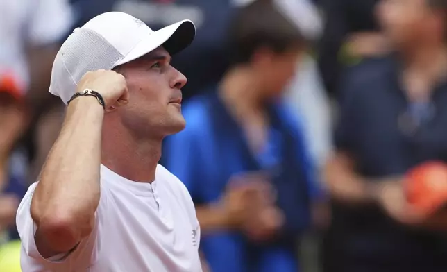 Tommy Paul of the U.S. reacts after beating Australia's Alexei Popyrin during their fourth round match of the French Tennis Open, at the Roland-Garros stadium, in Paris, Sunday, June 1 2025. (AP Photo/Lindsey Wasson)