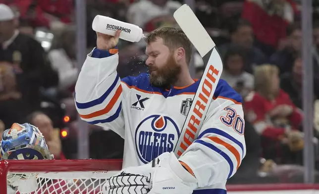 Edmonton Oilers goaltender Calvin Pickard (30) takes a break during the second period of Game 4 of the NHL hockey Stanley Cup Final against the Florida Panthers.Thursday, June 12, 2025, in Sunrise, Fla. (AP Photo/Lynne Sladky)