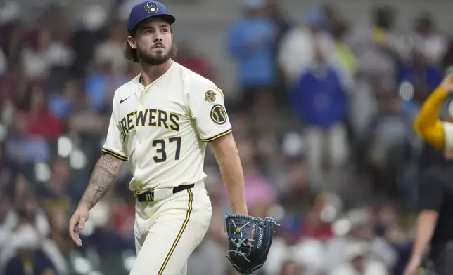 Milwaukee Brewers' DL Hall looks on as he walks to the dugout during the sixth inning of a baseball game against the Atlanta Braves, Monday, June 9, 2025, in Milwaukee. (AP Photo/Aaron Gash)