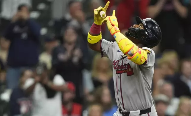 Atlanta Braves' Ronald Acuña Jr. gestures after hitting a solo home run during the fifth inning of a baseball game against the Milwaukee Brewers, Monday, June 9, 2025, in Milwaukee. (AP Photo/Aaron Gash)