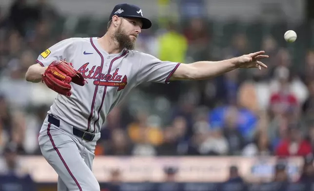 Atlanta Braves' Chris Sale throws to first base during the first inning of a baseball game against the Milwaukee Brewers, Monday, June 9, 2025, in Milwaukee. (AP Photo/Aaron Gash)