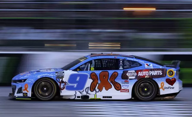 Driver Chase Elliott (9) moves along the track during a NASCAR Cup Series auto race, Saturday, June 28, 2025, in Hampton, Ga. (AP Photo/Butch Dill)
