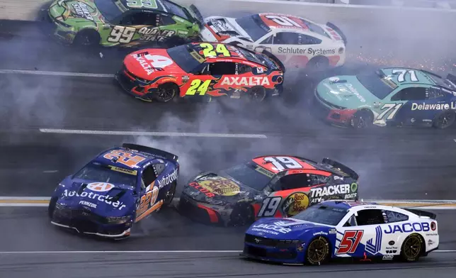 Driver Joey Logano (22) along with over twenty other drivers get tangled up in a wreck in turn three of lap sixty nine during a NASCAR Cup Series auto race, Saturday, June 28, 2025, in Hampton, Ga. (AP Photo/Russell Norris)