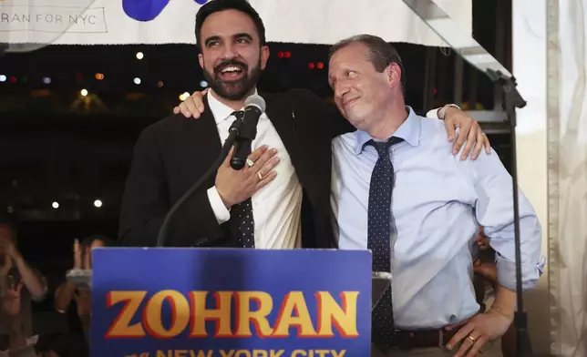 Democratic mayoral candidate Zohran Mamdani, left, speaks on stage with fellow candidate Comptroller Brad Lander at his primary election party, Wednesday, June 25, 2025, in New York. (AP Photo/Heather Khalifa)