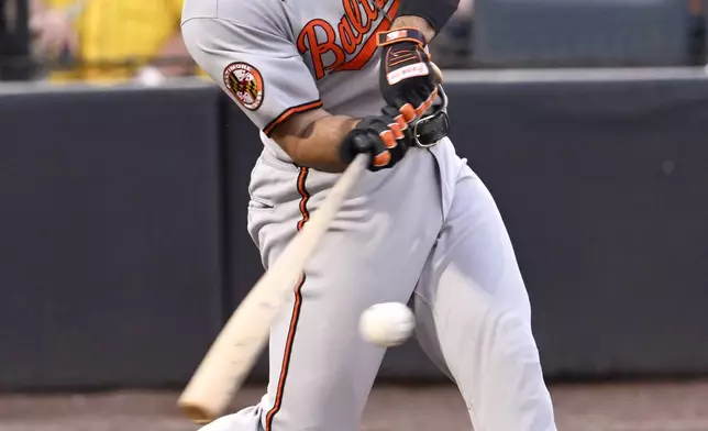 Baltimore Orioles' Ramón Laureano hits a three-run home run during the second inning of a baseball game against the Tampa Bay Rays, Wednesday, June 18, 2025, in Tampa, Fla. (AP Photo/Jason Behnken)