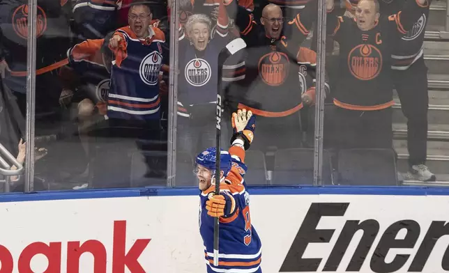 Edmonton Oilers' Corey Perry (90) celebrates a goal against the Florida Panthers during the third period in Game 2 of the NHL Stanley Cup final in Edmonton, Friday, June 6, 2025. (Jason Franson/The Canadian Press via AP)