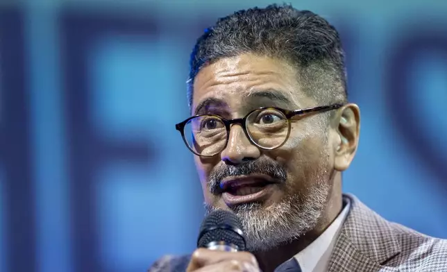 José Luis Orozco, a pastor from Nicaragua, ministers to members of the Oasis Church, in Taylor, Texas, June 15, 2025. (AP Photo/Rodolfo Gonzalez)