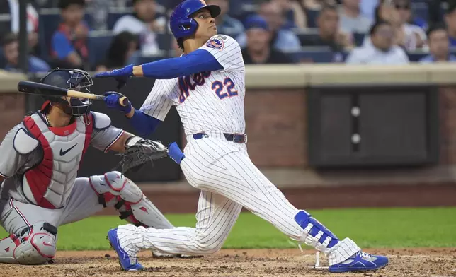 New York Mets' Juan Soto follows through on a home run during the third inning of a baseball game against the Washington Nationals Tuesday, June 10, 2025, in New York. (AP Photo/Frank Franklin II)