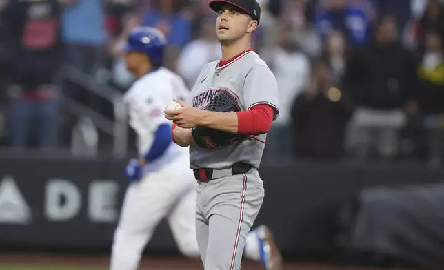 Washington Nationals pitcher MacKenzie Gore reacts as New York Mets' Juan Soto runs the bases after hitting a home run during the third inning of a baseball game Tuesday, June 10, 2025, in New York. (AP Photo/Frank Franklin II)