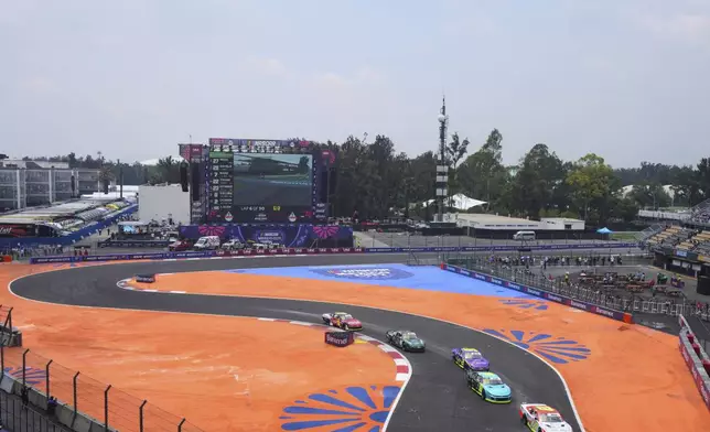 NASCAR Mexico cars drive through turn Th13 prior to a practice session for the NASCAR Cup Series auto race at the Hermanos Rodriguez race track in Mexico City, Friday, June 13, 2025. (AP Photo/Fernando Llano)