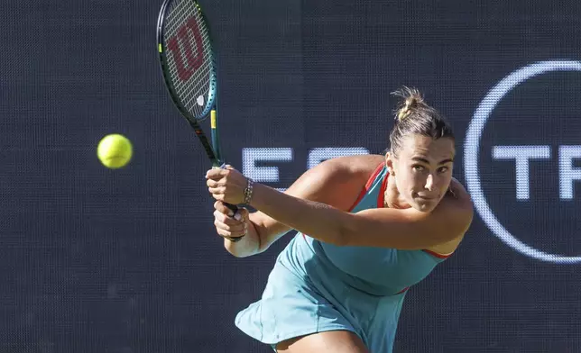 Belarus' Aryna Sabalenka returns a shot to Kazakhstan's Elena Rybakina, during their women's singles quarterfinal match of the Berlin WTA tennis tournament, in Berlin, Friday, June 20, 2025. (Andreas Gora/dpa via AP)