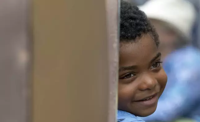 A young boy attends a Juneteenth celebration at the African Burying Ground Memorial Park Thursday, June 19, 2025, in Portsmouth, N.H. (AP Photo/Michael Dwyer)