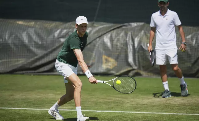 Jannik Sinner of Italy plays a return during a practice session ahead of the Wimbledon Championships in London, Friday, June 27, 2025. (AP Photo/Kin Cheung)