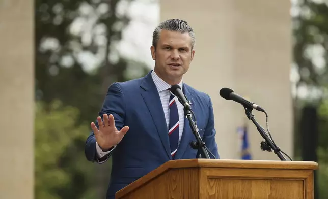 U.S. Defense Secretary Pete Hegseth delivers a speech at the US cemetery to commemorate the 81st anniversary of the D-Day landings, Friday, June 6, 2025 in Colleville-sur-Mer, Normandy. (AP Photo/Thomas Padilla)