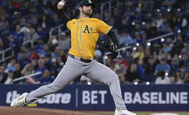 Athletics starting pitcher Gunnar Hoglund (53) throws to a Toronto Blue Jays batter in the first inning of a baseball game in Toronto, Saturday, May 31, 2025. (Jon Blacker/The Canadian Press via AP)