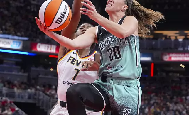 New York Liberty guard Sabrina Ionescu (20) shoots in front of Indiana Fever forward Aliyah Boston (7) in the first half of a WNBA basketball game in Indianapolis, Saturday, May 24, 2025. (AP Photo/Michael Conroy)