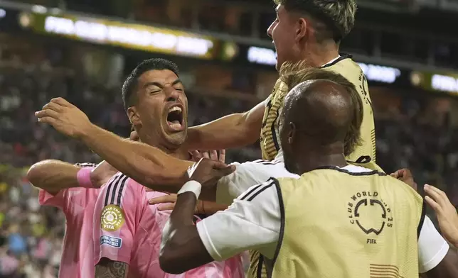 Inter Miami's Luis Suarez celebrates after scoring his side's second goal against Palmeiras during the Club World Cup Group A soccer match between Inter Miami and Palmeiras in Miami Gardens, Fla., Monday, June 23, 2025. (AP Photo/Lynne Sladky)