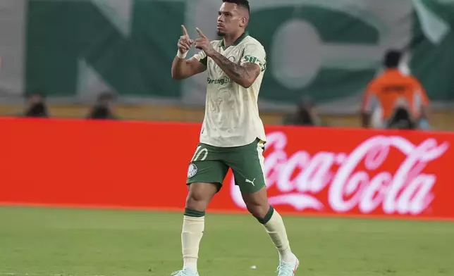 Palmeiras' Paulinho celebrates after scoring his side's first goal during the Club World Cup Group A soccer match between Inter Miami and Palmeiras in Miami Gardens, Fla., Monday, June 23, 2025. (AP Photo/Lynne Sladky)