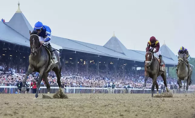 Sovereignty (2), with jockey Junior Alvarado up, crosses the finish line ahead of Journalism (7), with jockey Umberto Rispoli up, and Baeza (6), with jockey Flavien Prat up, to win the 157th running of the Belmont Stakes horse race, Saturday, June 7, 2025, in Saratoga Springs, N.Y. (AP Photo/Seth Wenig)