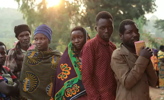 Voters line up to cast their votes in the Burundian legislative elections at Musama Primary School, in Gitega, Burundi, Thursday, June 5, 2025. (AP Photo/Berthier Mugiraneza)