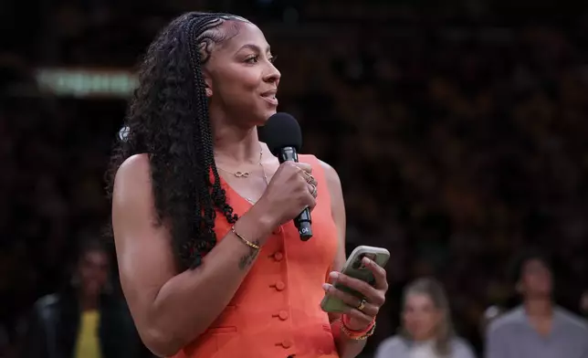 Former Los Angeles Sparks player Candace Parker speaks during her jersey retirement ceremony during a WNBA basketball game between the Sparks and the Chicago Sky, Sunday, June 29, 2025, in Los Angeles. (AP Photo/Jessie Alcheh)