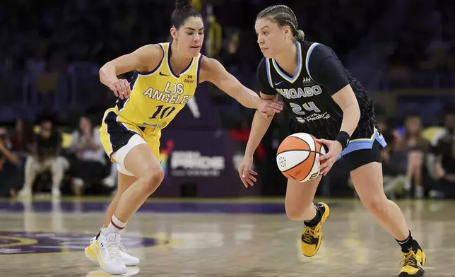 Chicago Sky guard Rachel Banham (24) dribbles against Los Angeles Sparks guard Kelsey Plum (10) during the first half of a WNBA basketball game, Sunday, June 29, 2025, in Los Angeles. (AP Photo/Jessie Alcheh)