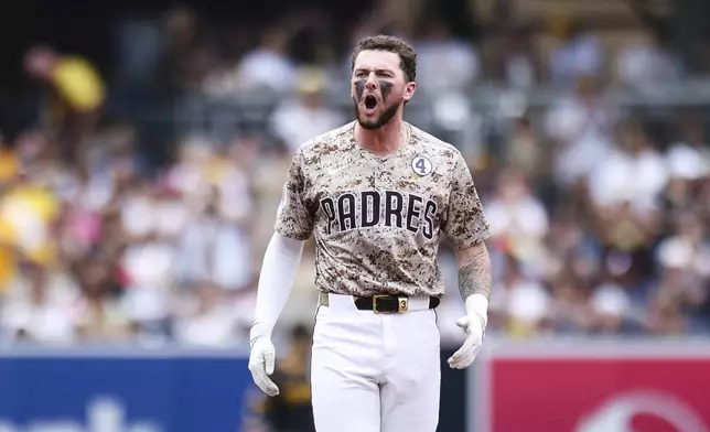 San Diego Padres' Jackson Merrill reacts after hitting an RBI double against the Pittsburgh Pirates in the sixth inning of a baseball game Sunday, June 1, 2025, in San Diego. (AP Photo/Derrick Tuskan)