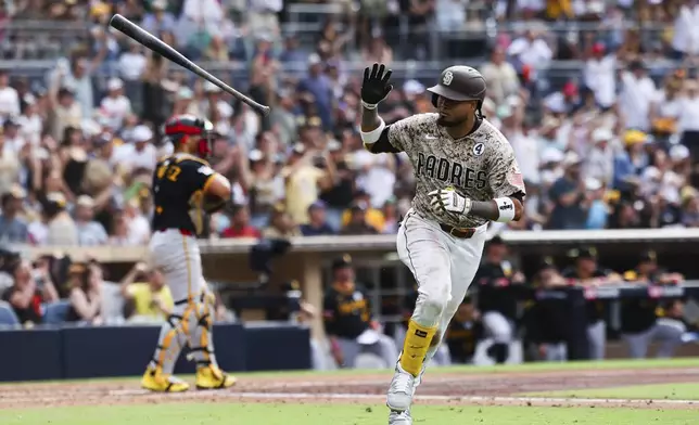 San Diego Padres' Luis Arraez tosses his bat after hitting an RBI single against the Pittsburgh Pirates in the seventh inning of a baseball game Sunday, June 1, 2025, in San Diego. (AP Photo/Derrick Tuskan)