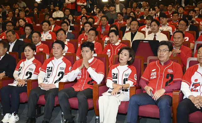 Lawmakers of the People Power Party watch television coverage of the exit polls for the presidential election at the National assembly in Seoul, South Korea, Tuesday June 3, 2025. (Song Kyung Seok/Pool via AP)