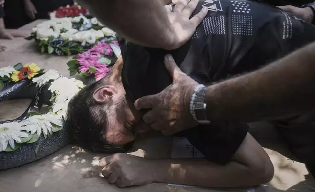 Relatives attend the funeral of four members of the Khatib family, Palestinian citizens of Israel killed in an Iranian missile strike on Tamra, Israel, on Tuesday, June 17, 2025. (AP Photo/Mahmoud Illean)