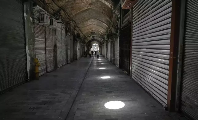 Shops remain shuttered Tehran's historic Grand Bazaar, Monday, June 16, 2025. (AP Photo/Vahid Salemi)