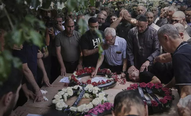 Relatives attend the funeral of four members of the Khatib family, Palestinian citizens of Israel killed in an Iranian missile strike on Tamra, Israel, on Tuesday, June 17, 2025. (AP Photo/Mahmoud Illean)