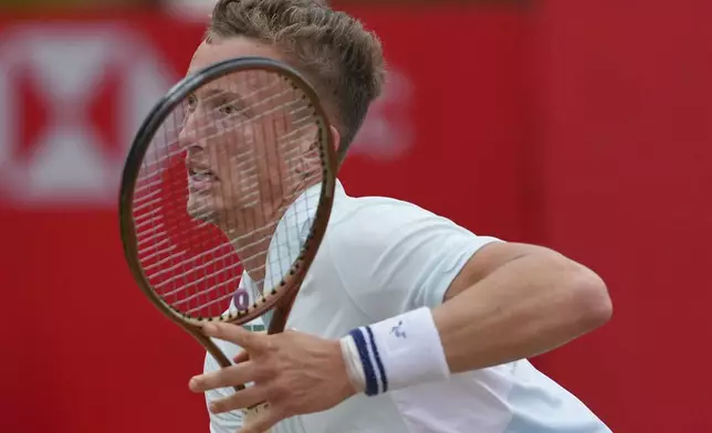 Jiri Lehecka of the Czech Republic reacts after playing a return to Carlos Alcaraz of Spain, during the men's singles final of the Queens Club tennis championships in London, Sunday, June 22, 2025. (AP Photo/Joanna Chan)